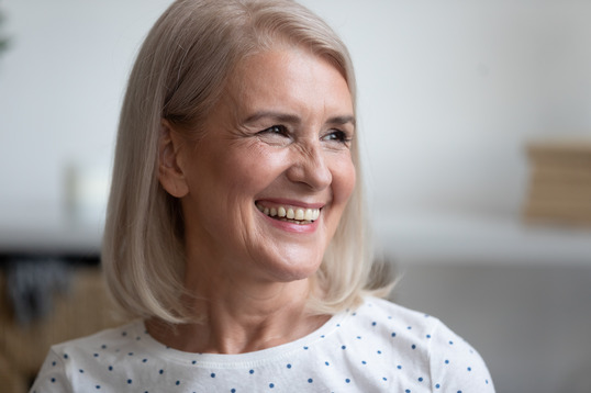 closeup of person smiling after getting dental implants 