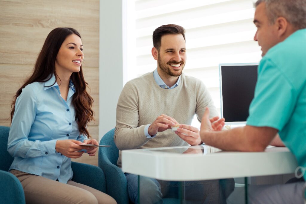 Couple consults with dentist